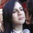 A pixelated image shows a person with dark hair and a white headband on the left, next to a black background with white pixelated text reading "max green" and "okiss".