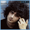 Animated contact sheet of a person with curly hair in various poses and expressions, including hand-to-face gestures and glasses-wearing frames.