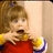 Pixelated image of a child in a red dress with yellow sleeves and blue trim, hands near face, next to red text "U Got It" and "DUDE!!!!!!" on white and gray background.
