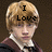 Pixelated image of a person with light brown hair wearing a maroon robe over white shirt and dark tie, showing text overlays across different frames.