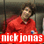 A static image of three people with overlaid text labels: red 'nick jonas', blue 'joe jonas', and black 'kevin jonas' in pixelated fonts.
