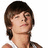 A pixelated image of a person with brown hair in two side-by-side frames, the right frame displaying pink text.