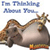 Pixelated static image of a cartoon animal character with brown fur, wearing orange shorts and a crown-like headpiece, lying on its side against a white background with blue text above it.