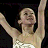 A 2x2 contact sheet of a figure skater in a white dress with arms raised, accompanied by text elements on black and gray backgrounds.