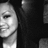 Pixelated grayscale image of a person's face in profile view, showing eye, nose, and mouth with visible hairline against dark background.