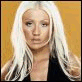25 identical frames showing a person with long white hair against an orange background, wearing a black top