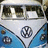 Pixelated image of a light blue and white van with Volkswagen logo, next to green background with black text.