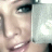 Pixelated close-up of a person's face with visible eye, nose, mouth, and partial hair against light background.