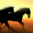 A pixelated image of a black horse rearing against an orange and yellow gradient background with the text "I love to ride" in orange block letters on the right.