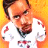 Pixelated static image of a person with dark hair and beard wearing white shirt against orange background, featuring two speech bubbles with red text.