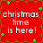 Red background with green star shapes and brown decorative patterns, displaying white text reading 'christmas time is here!' in four identical quadrants.