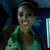 Pixelated static image of a person with dark hair wearing a green and brown patterned top against a blue background.