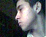 A sequence of showing a person in profile view with subtle head movements and changing facial expressions against a dark background