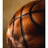 A basketball with visible seams and a light brown background, showing slight pixelation.