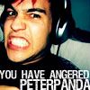 A close-up of a person with dark hair wearing headphones, showing an angry expression with teeth bared, overlaid with bold white text reading "YOU HAVE ANGERED PETERPANDA" on a dark background.