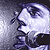 Pixelated close-up of a stylized face with large eyes and flowing hair against a gradient background.