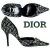 A static pixelated image shows a black high-heeled shoe with a pointed toe and stiletto heel, positioned next to the word 'DIOR' in stylized gray lettering on a white background.