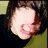 A person with dark hair and a black turtleneck appears in two , one showing the face turned left and another right