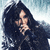 Pixelated static image of a person with long dark hair holding an object against a light blue background.