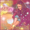 A woman with long brown hair sits with legs crossed, wearing a maroon top and rolled blue jeans, surrounded by glittering light effects and the word 'glitter' in pink cursive.