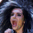 A four- shows a person with long dark hair in various poses, including shouting into a microphone and smiling, with red text reading "SCHREI!" and "SCREAM!" on black backgrounds