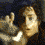 Animated sequence showing a figure with light brown hair and fair skin making hand gestures against dark background.