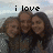 Pixelated image of four people with long dark hair in a group pose, overlaid text reads 'i love these girls!' against a light background.