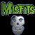 Static pixelated icon featuring green text 'Misfits' above a gray skull with blue eyes on black background.