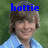 Pixelated image of a person with brown hair wearing a light blue shirt, with blue text reading 'hottie' overlaid at the top against a green background.