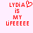 Red pixelated text on light pink background reads LYDIA is MY LIFE with a heart symbol replacing the 'A' in LYDIA in one view.