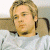 A pixelated image of a person with light brown hair wearing a white shirt, positioned next to green text reading 'Original Icons .com' on a dark background.