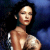 Pixelated image of a person with dark hair against blue and black background, showing upper torso without clothing.