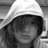 Black-and-white photo of a hooded figure with obscured face, paired with red text on black background reading "I Am Different =]" and two variations below.