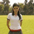 A split-screen image shows a person in a white shirt with red trim on a grassy field, with legs and black socks visible on the right side, and green background with text "Lupita Fernandez" below.