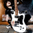 A pixelated image shows a person holding a white electric guitar against a red background with "ROCK ON !!" text.