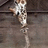 A small animated icon shows a cartoon character with light brown hair and a white top with black patterns, standing on a dark wooden floor with a dark background.