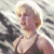 A pixelated image of a person with short blonde hair wearing a dark halter top, positioned next to green text reading "Original Icons .com" on a solid background.