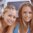 A 48x48 pixel animated contact sheet showing two frames of a buddy icon featuring two women on the left and green text "OriginalIcons.com" on the right against a dark background.