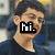 A four- shows a person with dark hair and glasses in sequential text overlays: 'hi.', 'i am', then 'McLovin' across the lower