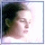 pixelated images showing a person with dark hair in a white shirt, each containing blue text that changes across frames