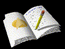 Open notebook with yellow sticky note and pencil on black background, showing subtle animation changes across frames.