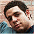 A 50x50 pixel buddy icon split into two sections: a pixelated portrait on the left and green text on a dark background on the right.