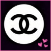 A circular white icon with a black interlocking CC logo on a dark background, bordered by a pink frame with three pink hearts in the bottom-right corner.
