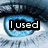 A pixelated close-up of a blue-eyed human eye with text overlays reading 'I used', 'to be', and 'love drunk' across three