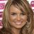 A static pixelated image of a person with light brown hair and a smiling expression, set against a pink and white patterned background.