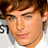 Pixelated image of a person with brown hair and blue eyes, split into four quadrants with green and gray backgrounds and pink text.