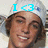 A pixelated image of a person with brown hair wearing a white cap, smiling broadly under blue text reading "I <3" on the left and "RYAN" on the right.
