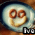 A circular icon with a blue rim shows a smiling face made of fried eggs and sausage rings, with text below changing from 'live' to 'love' to 'laugh'.