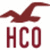 Maroon seagull silhouette above maroon 'HCO' text on white background, with visible pixelation and partial gray overlay in bottom-right.