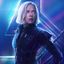 Pixelated static image of a person with light-colored hair wearing dark clothing against a blue-purple gradient background.